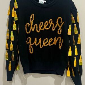 QOS CHEERS BLACK SWEATER WITH GOLD BOTTLE. UBER FUN!!